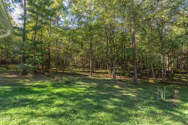 a view of balcony with outdoor seating and wooden floor