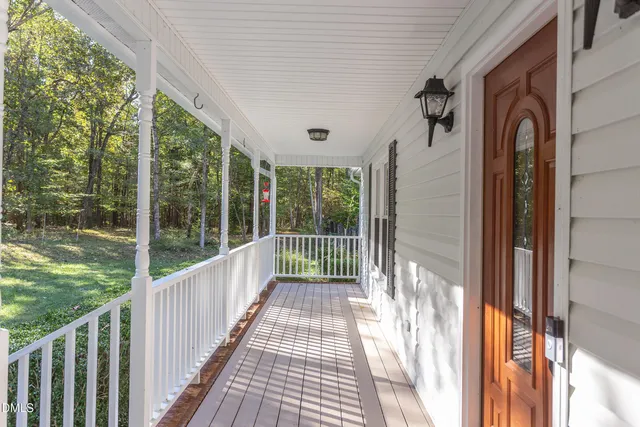 a view of balcony with wooden floor
