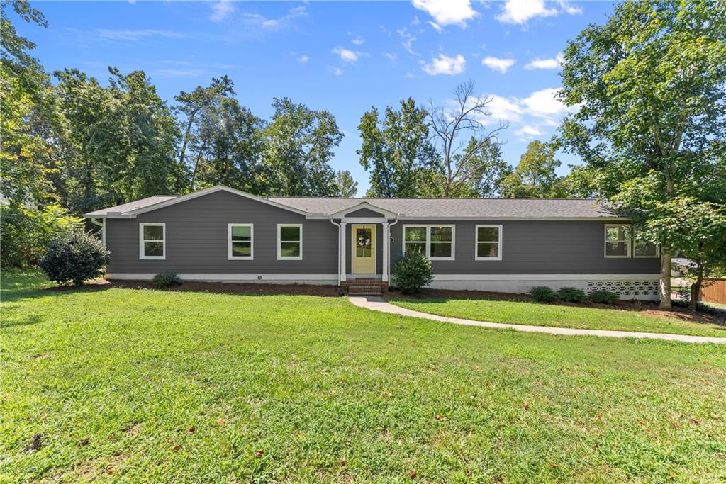 2260 Pilgrim Mill Road Cumming, GA 30041 - Photo 1 of 1 a front view of a house with a garden