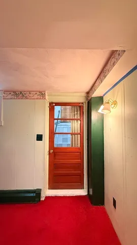 a view of a house with a cars parked in a yard