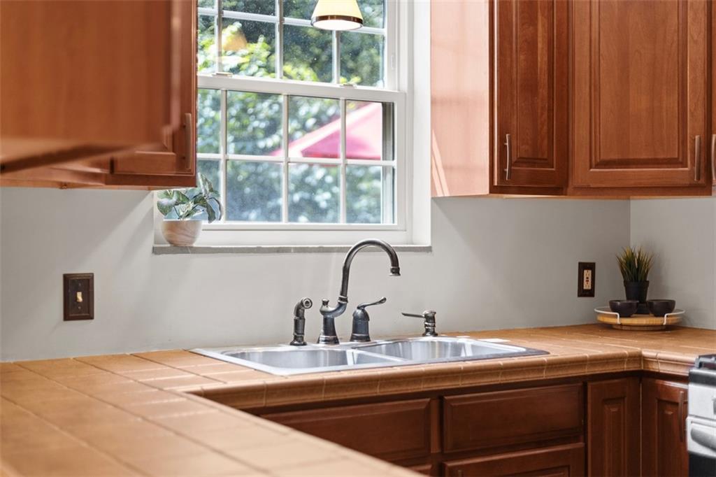 21 Bryn Mawr Road Pittsburgh, PA 15221 - Photo 13 of 42 a kitchen with stainless steel appliances granite countertop a sink a microwave and cabinets
