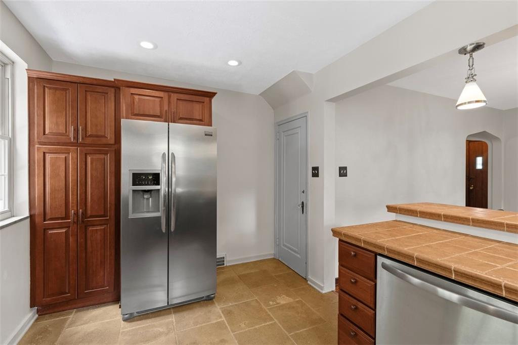 21 Bryn Mawr Road Pittsburgh, PA 15221 - Photo 14 of 42 a kitchen with stainless steel appliances granite countertop a refrigerator and a sink