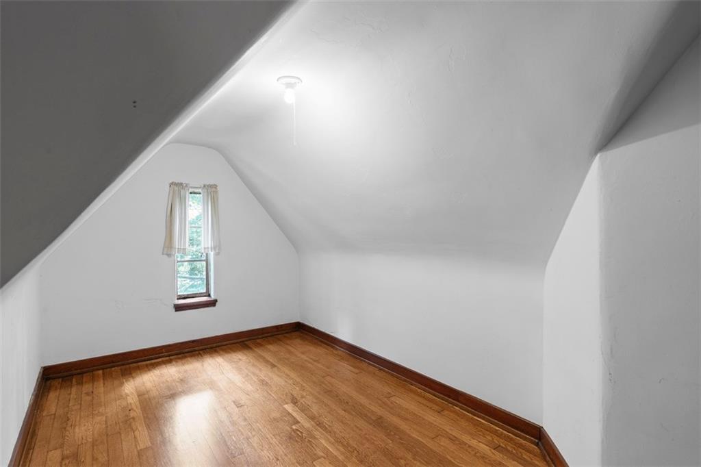 21 Bryn Mawr Road Pittsburgh, PA 15221 - Photo 23 of 42 a view of empty room with wooden floor and fan