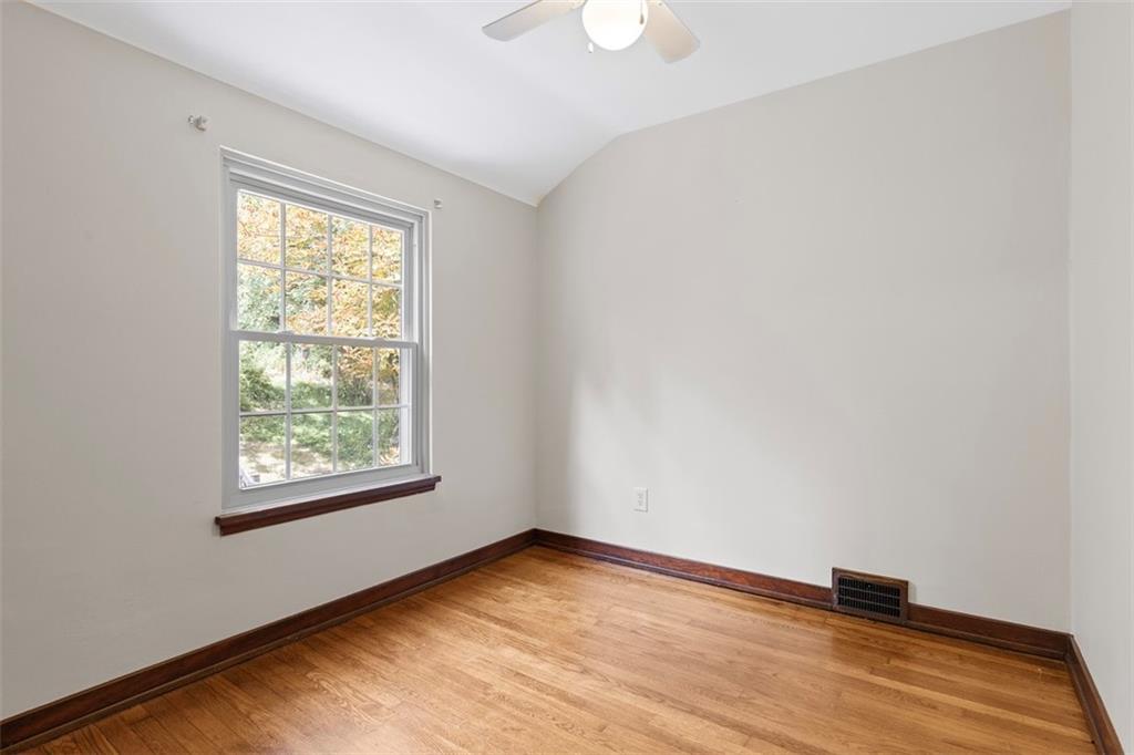 21 Bryn Mawr Road Pittsburgh, PA 15221 - Photo 25 of 42 an empty room with wooden floor and windows