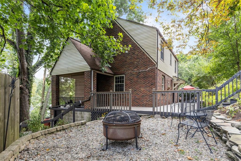 21 Bryn Mawr Road Pittsburgh, PA 15221 - Photo 30 of 42 a backyard of a house with table and chairs
