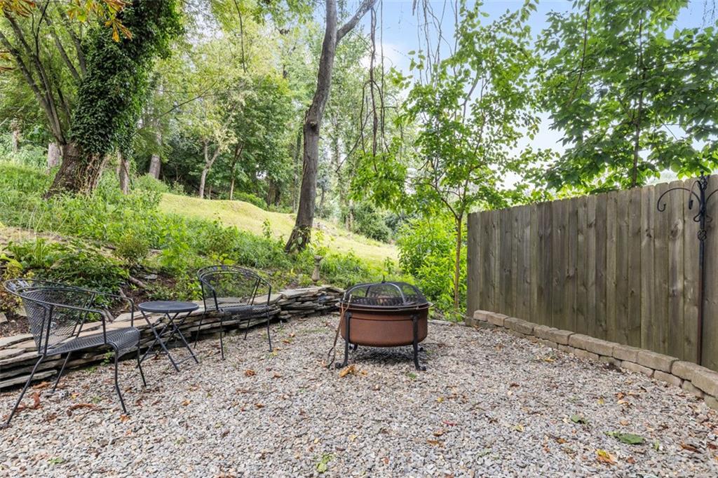 21 Bryn Mawr Road Pittsburgh, PA 15221 - Photo 31 of 42 a backyard of a house with chairs and a yard