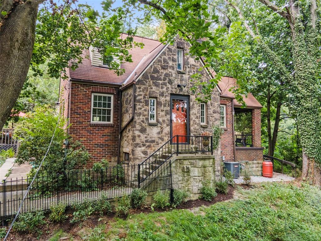 21 Bryn Mawr Road Pittsburgh, PA 15221 - Photo 42 of 42 front view of house with a yard and potted plants