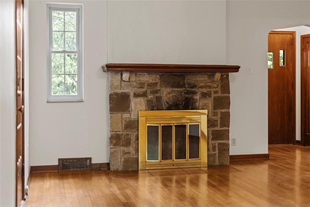 21 Bryn Mawr Road Pittsburgh, PA 15221 - Photo 7 of 42 a view of an empty room with wooden floor and a window