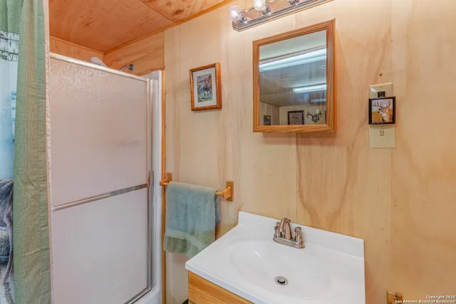 a bathroom with a sink and mirror