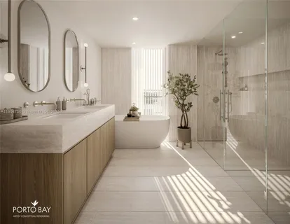 a bathroom with a double vanity sink mirror and shower