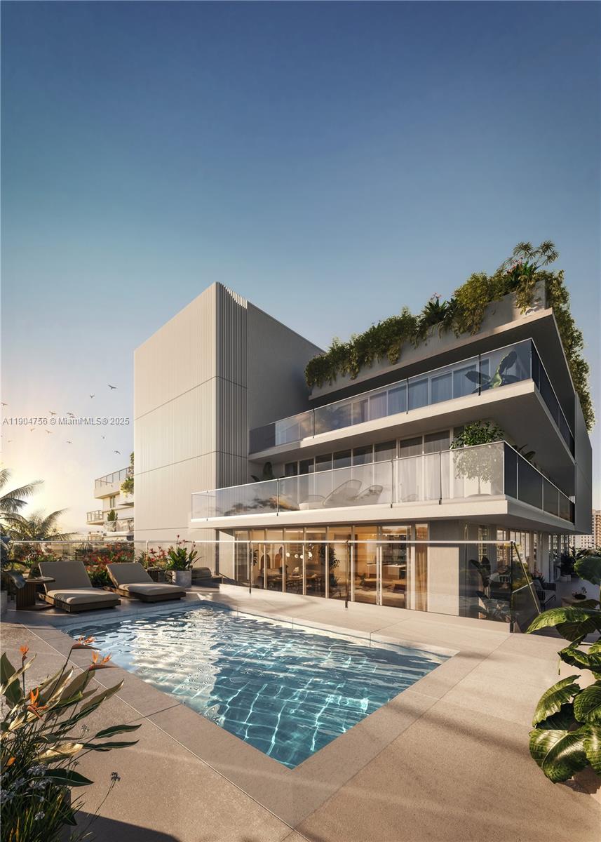 1130 100th Street, Unit PHA Bay Harbor Islands, FL 33154 - Photo 9 of 13 a front view of a house with a yard