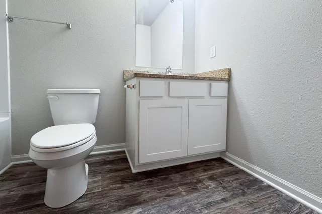 a bathroom with a toilet and a sink