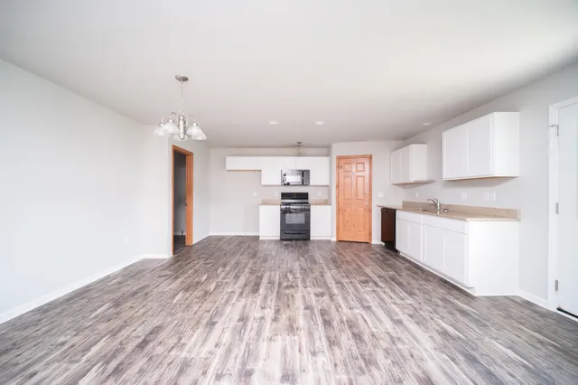 a view of kitchen with wooden floor