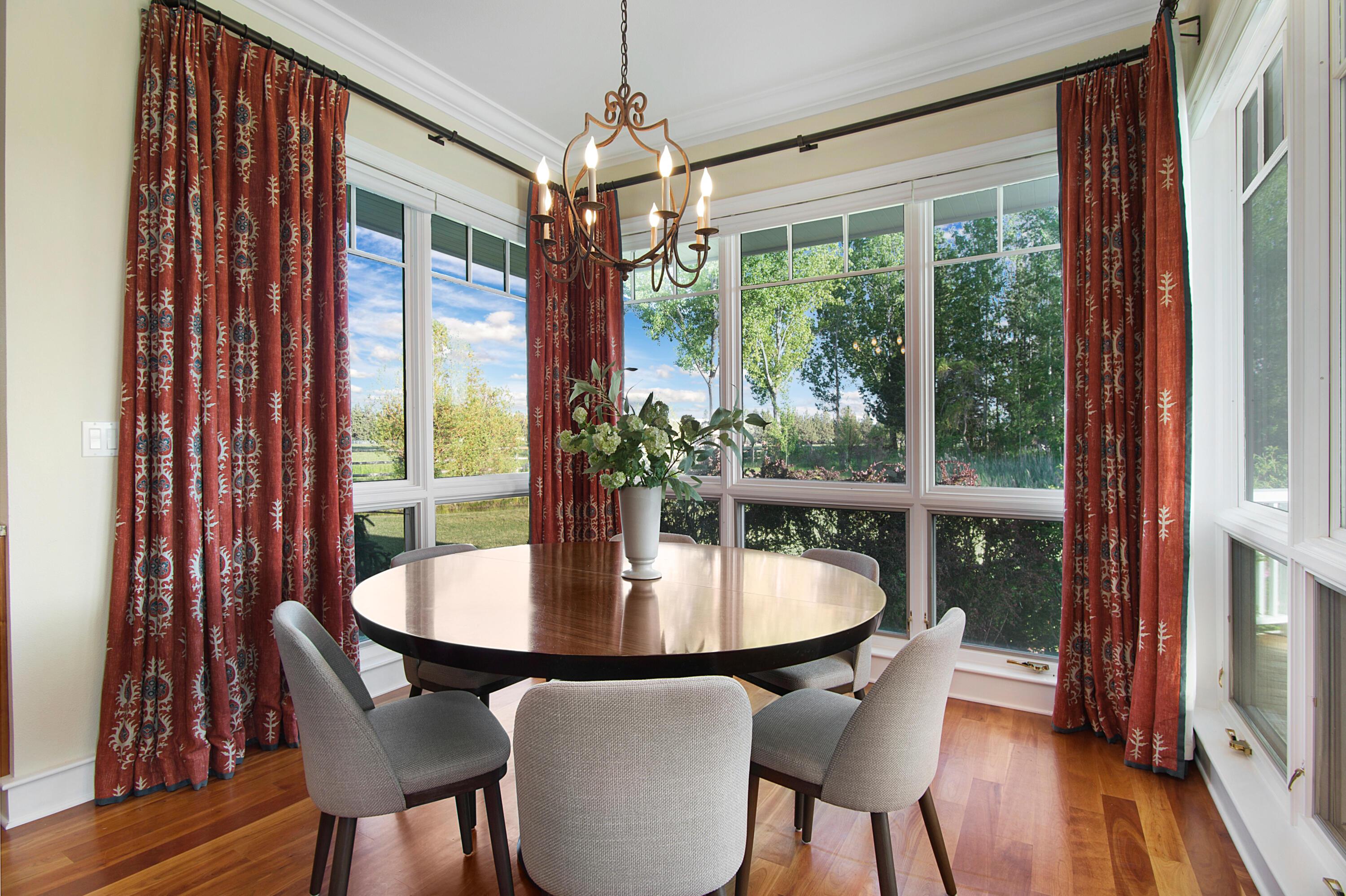 64950 Collins Road Bend, OR 97703 - Photo 23 of 87 a view of a dining room with furniture window and wooden floor