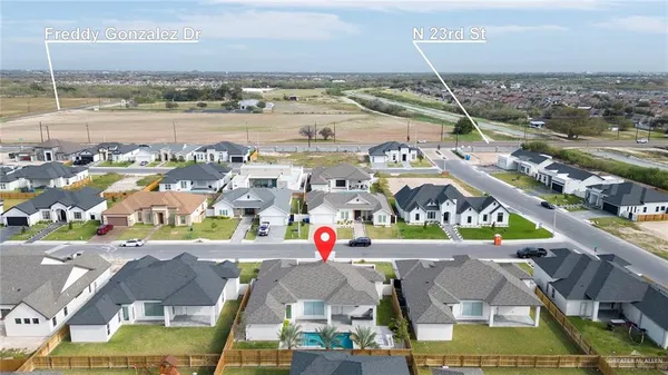 an aerial view of a house with a ocean view