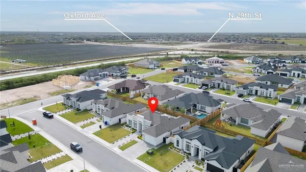 an aerial view of residential houses with outdoor space