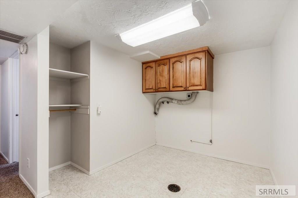 148 South 5th West Rexburg, ID 83440 - Photo 27 of 38 Lower Laundry Room, Room for folding cabinet and storage