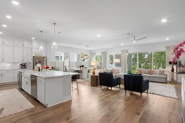 a bedroom with furniture and a flat screen tv