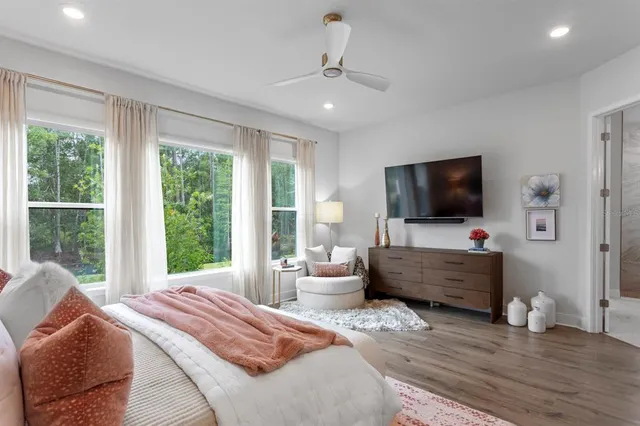 a bathroom with a double vanity sink a mirror and a shower