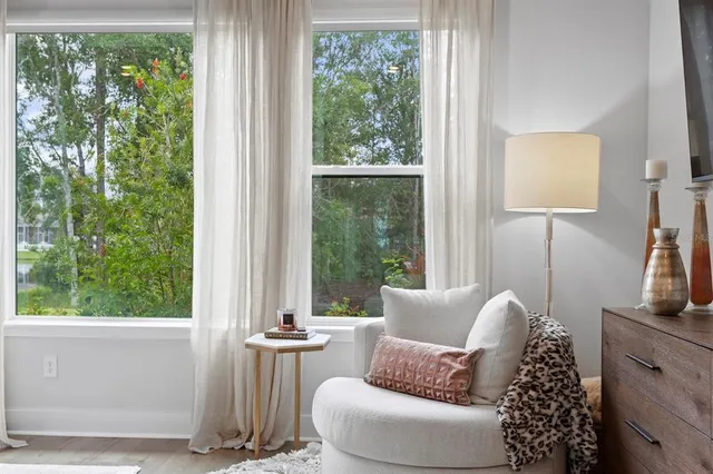 a spacious bathroom with double vanity and a mirror