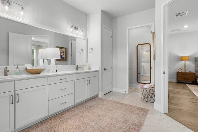 a bedroom with furniture and a window