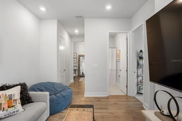 a bathroom with a sink a toilet and shower curtain