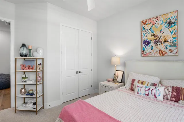 a bedroom with a bed and a couch