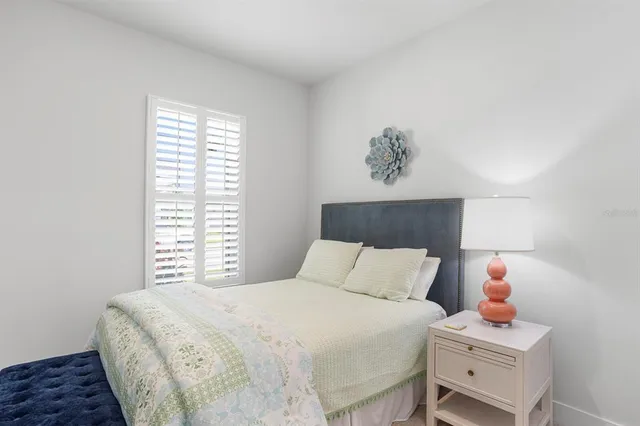 a bedroom with a bed and a cabinets