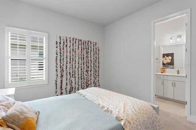 a bathroom with a sink a mirror and a shower