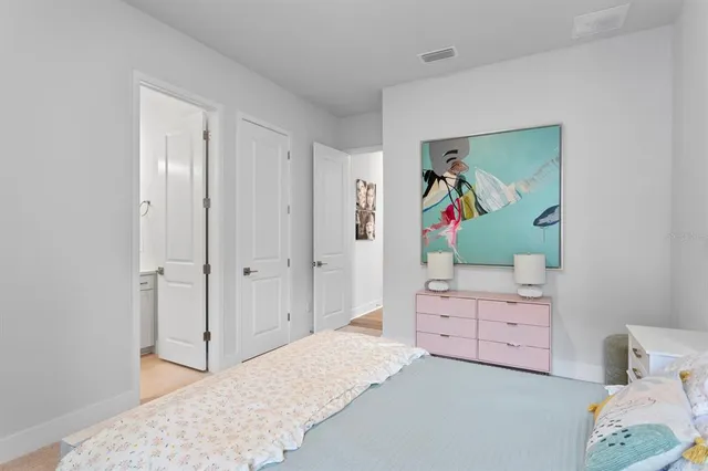 a bathroom with a toilet a sink and a mirror