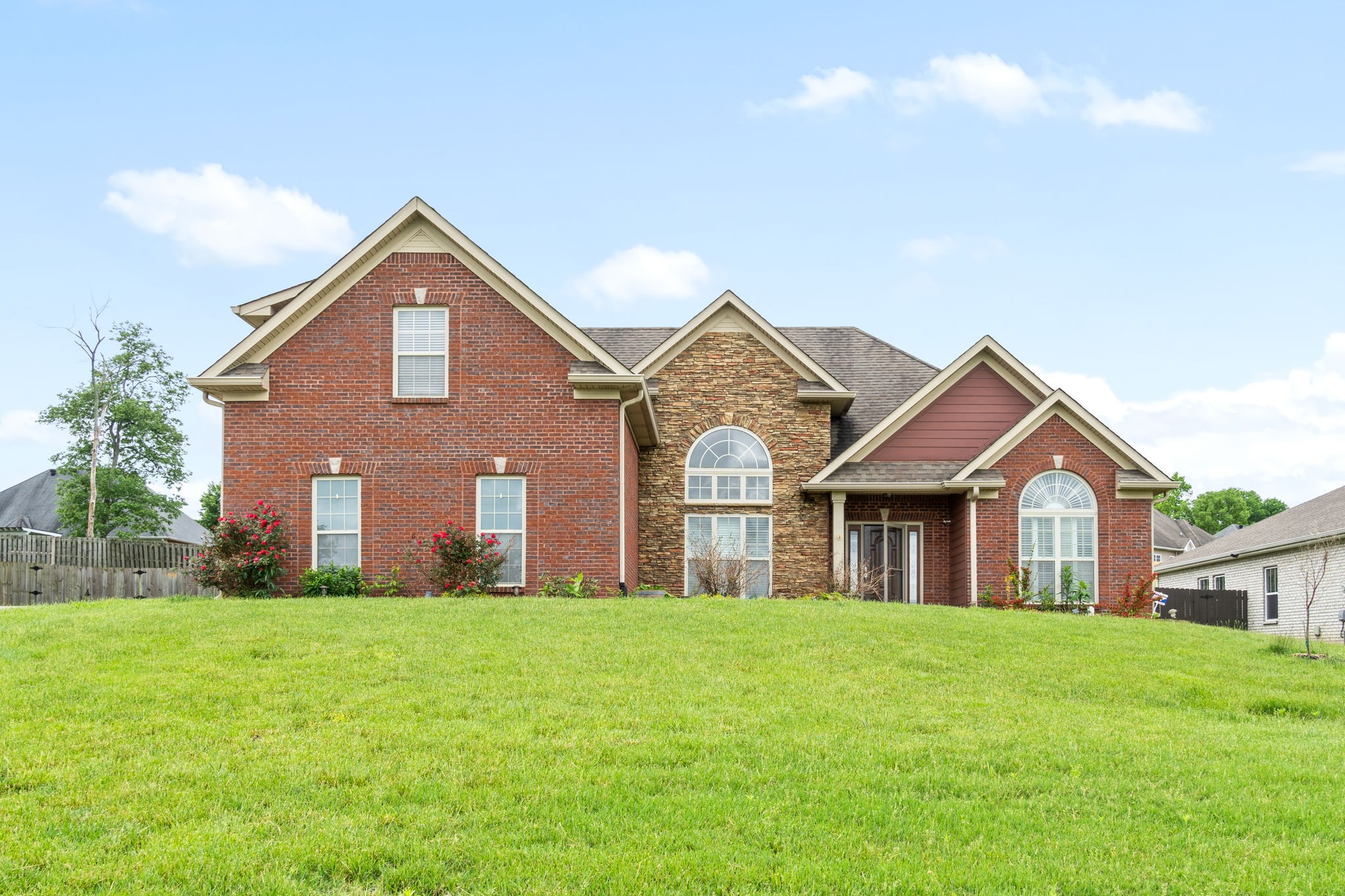 3544 Drake Road Adams, TN 37010 - Photo 3 of 39 a front view of a house with a yard and garage