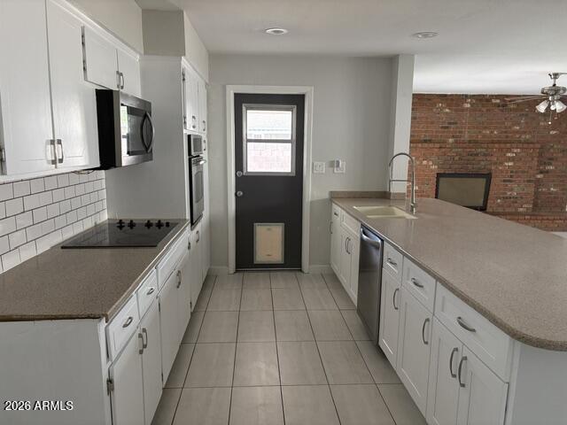 3244 West Yucca Street Phoenix, AZ 85029 - Photo 8 of 21 a kitchen with granite countertop a sink stove and cabinets