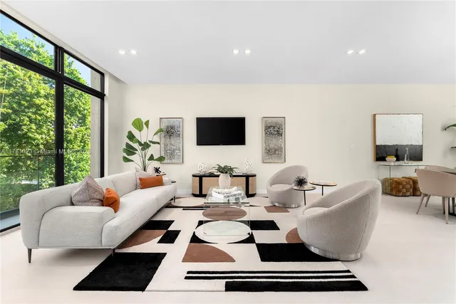 a dining room with furniture and window