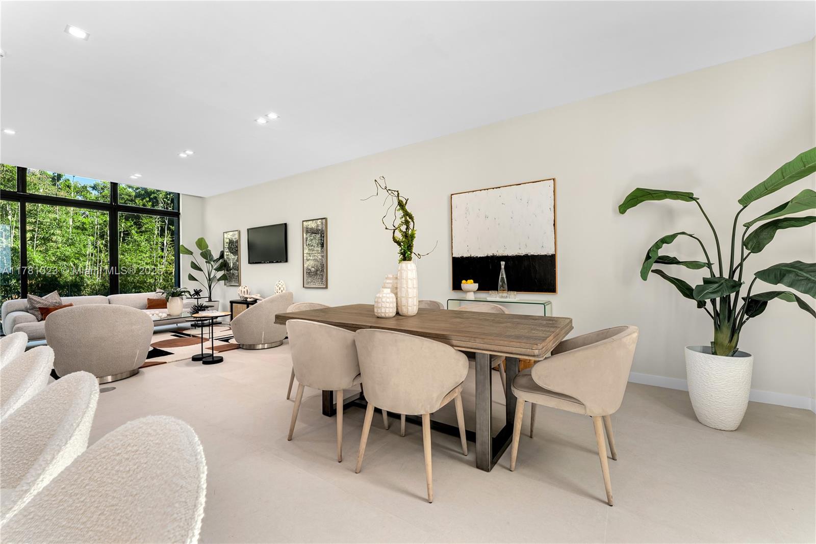 2501 Southwest 27th Street, Unit 2 Miami, FL 33133 - Photo 17 of 41 a living room with furniture a large window and a potted plant