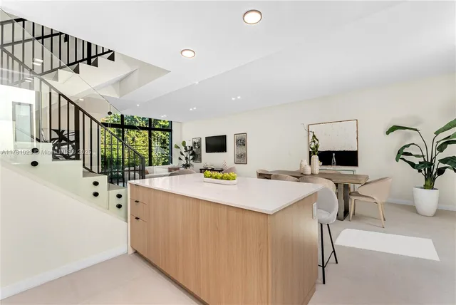 a balcony with a plant in front of it