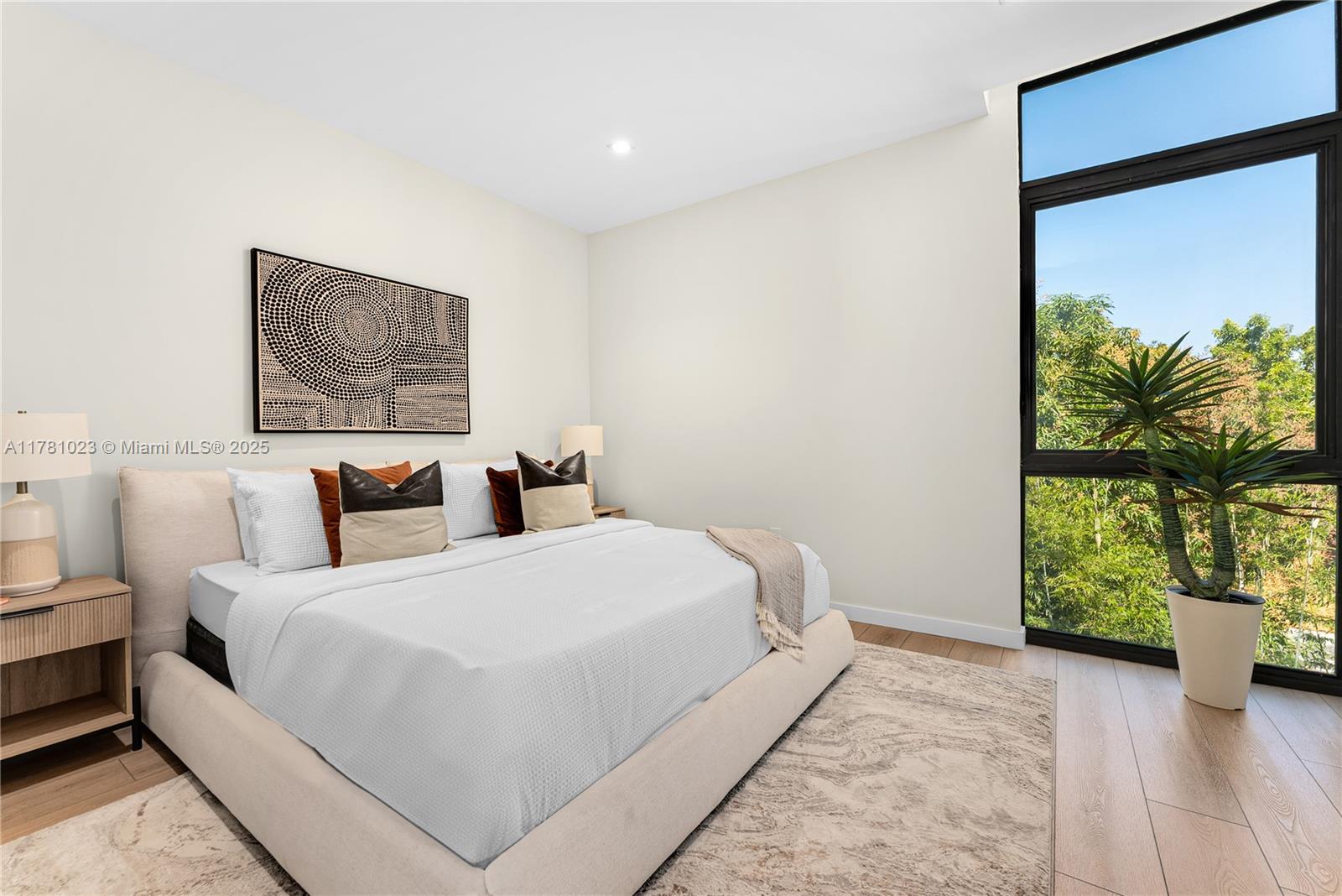 2501 Southwest 27th Street, Unit 2 Miami, FL 33133 - Photo 24 of 41 a bedroom with a bed and a large window