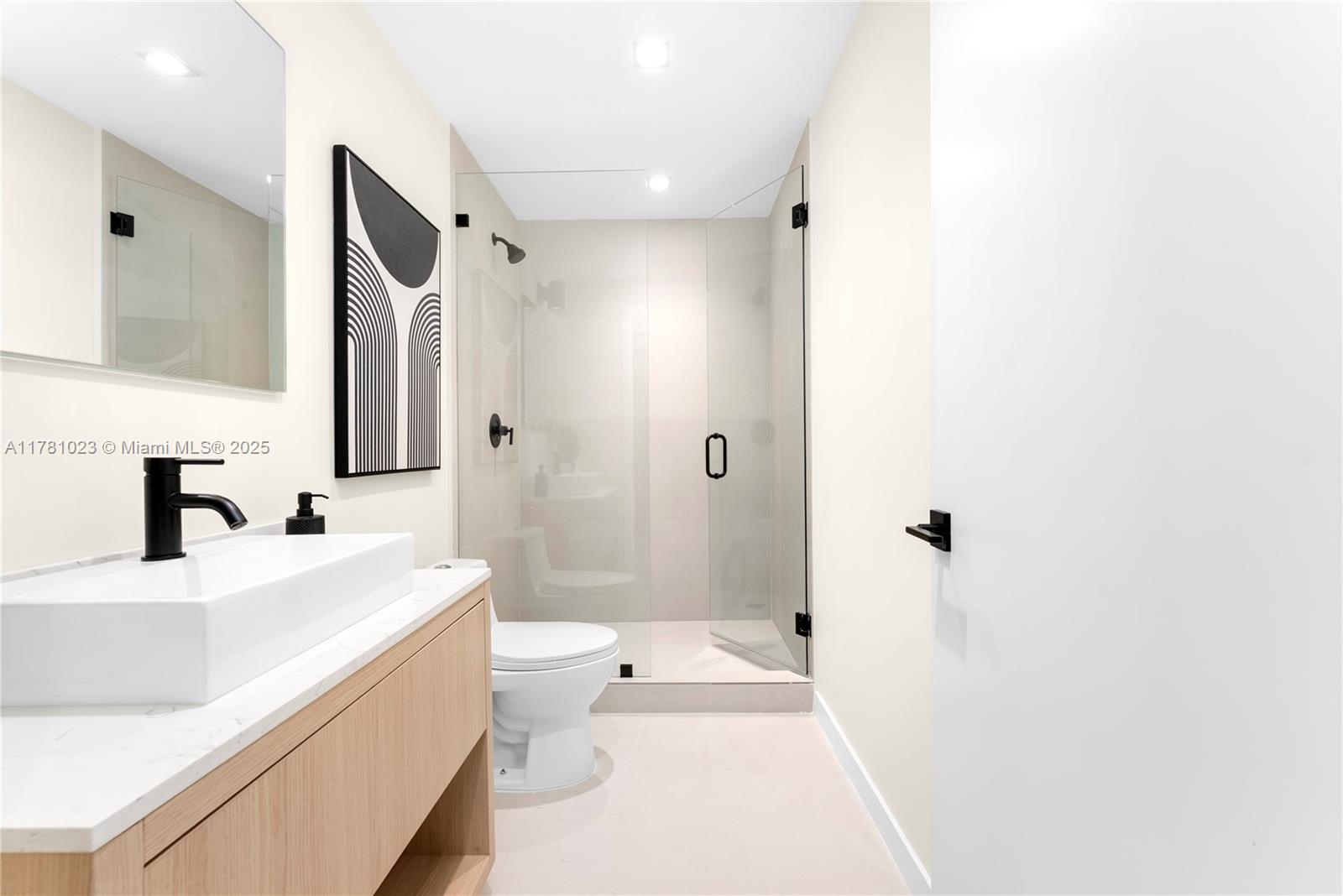 2501 Southwest 27th Street, Unit 2 Miami, FL 33133 - Photo 30 of 41 a bathroom with a sink a toilet and shower