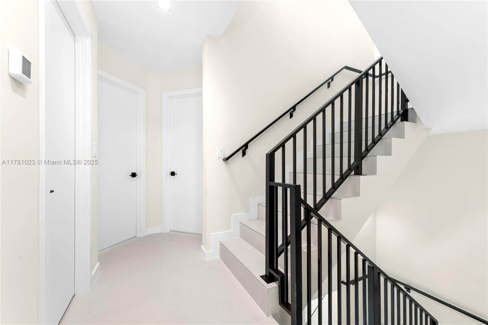 2501 Southwest 27th Street, Unit 2 Miami, FL 33133 - Photo 31 of 41 a view of staircase with railing and white walls