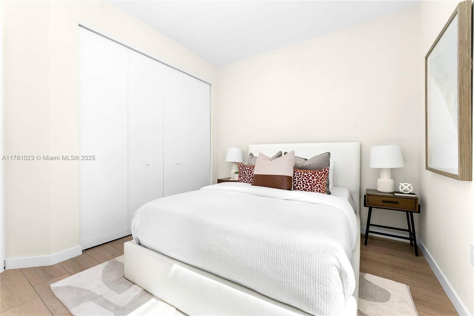 2501 Southwest 27th Street, Unit 2 Miami, FL 33133 - Photo 33 of 41 a large bed sitting in a bedroom next to a lamp