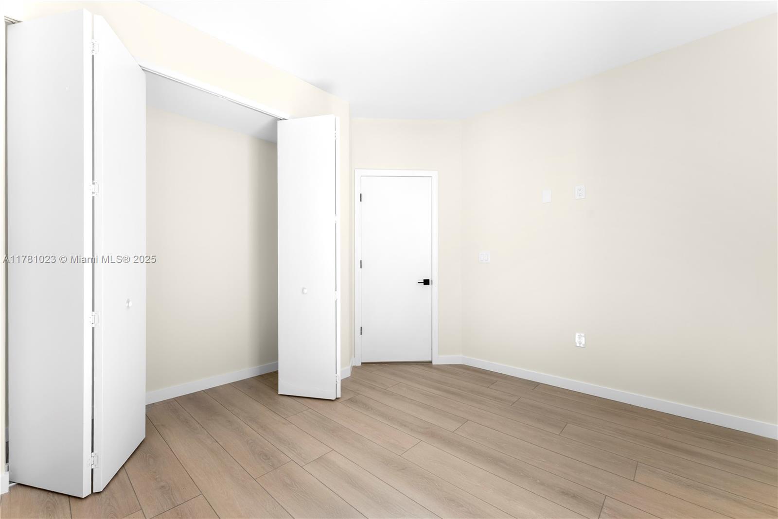 2501 Southwest 27th Street, Unit 2 Miami, FL 33133 - Photo 35 of 41 an empty room with wooden floor