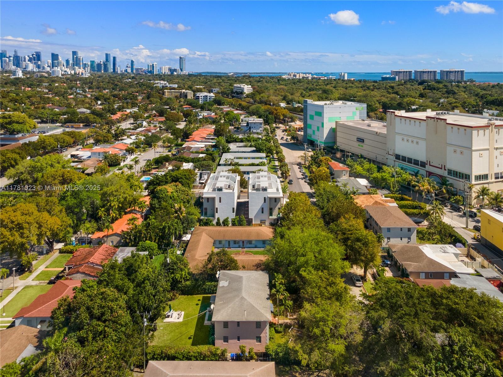2501 Southwest 27th Street, Unit 2 Miami, FL 33133 - Photo 4 of 41 an aerial view of residential houses with outdoor space and trees