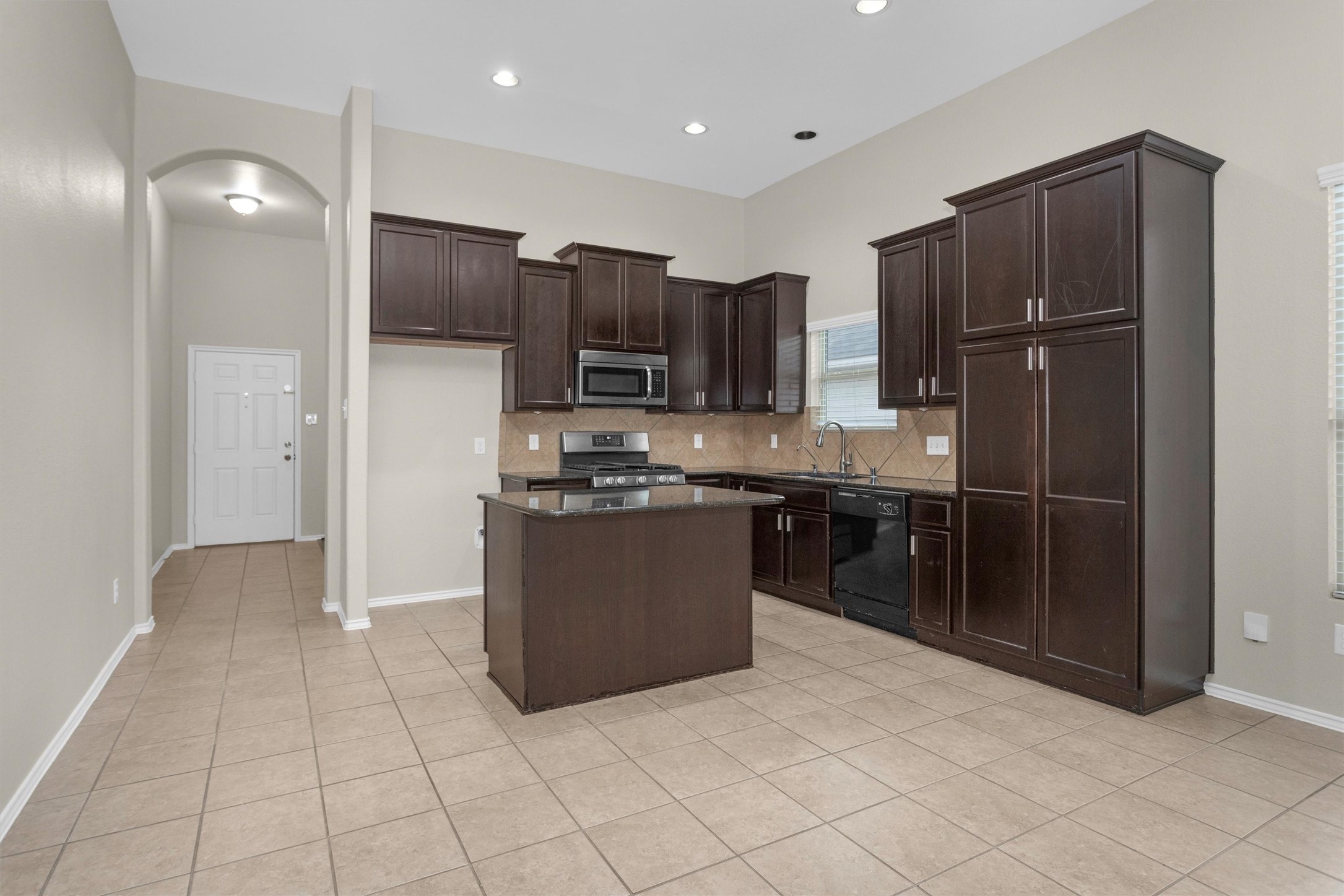 21419 Fossil Trails Drive Spring, TX 77388 - Photo 11 of 42 a kitchen with stainless steel appliances granite countertop a refrigerator and a stove