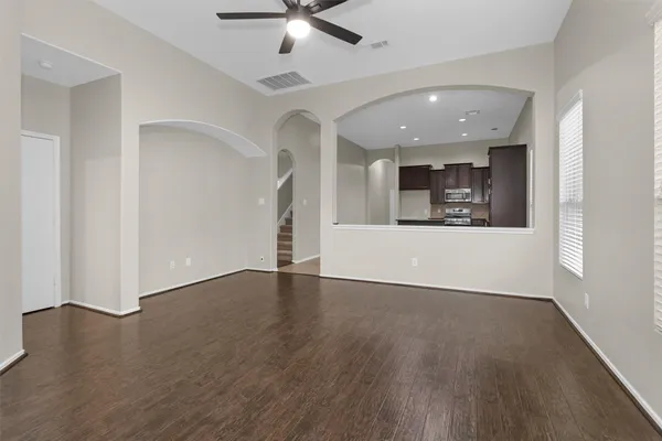 an empty room with windows and closet