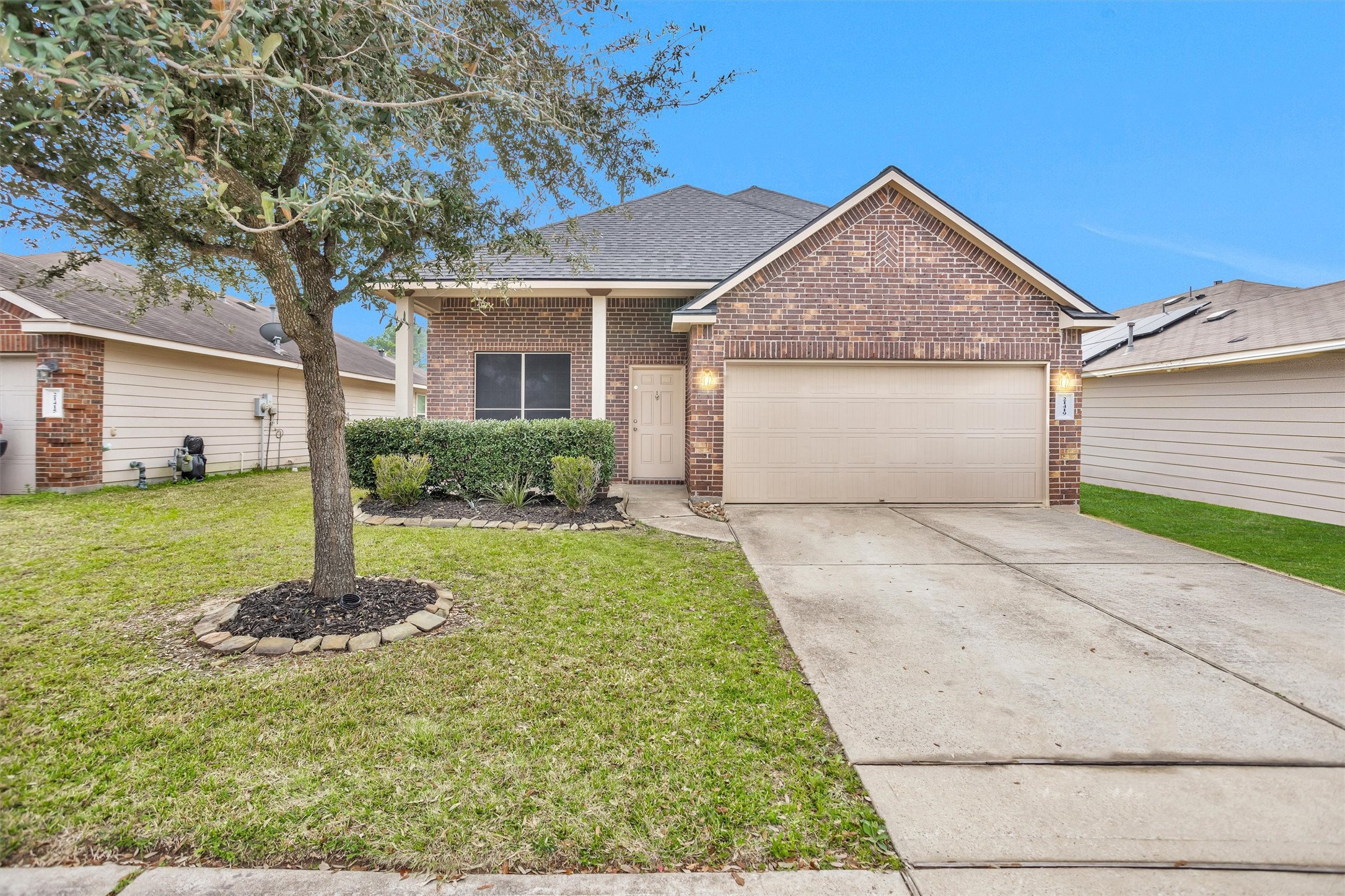 21419 Fossil Trails Drive Spring, TX 77388 - Photo 2 of 42 a front view of house with garden