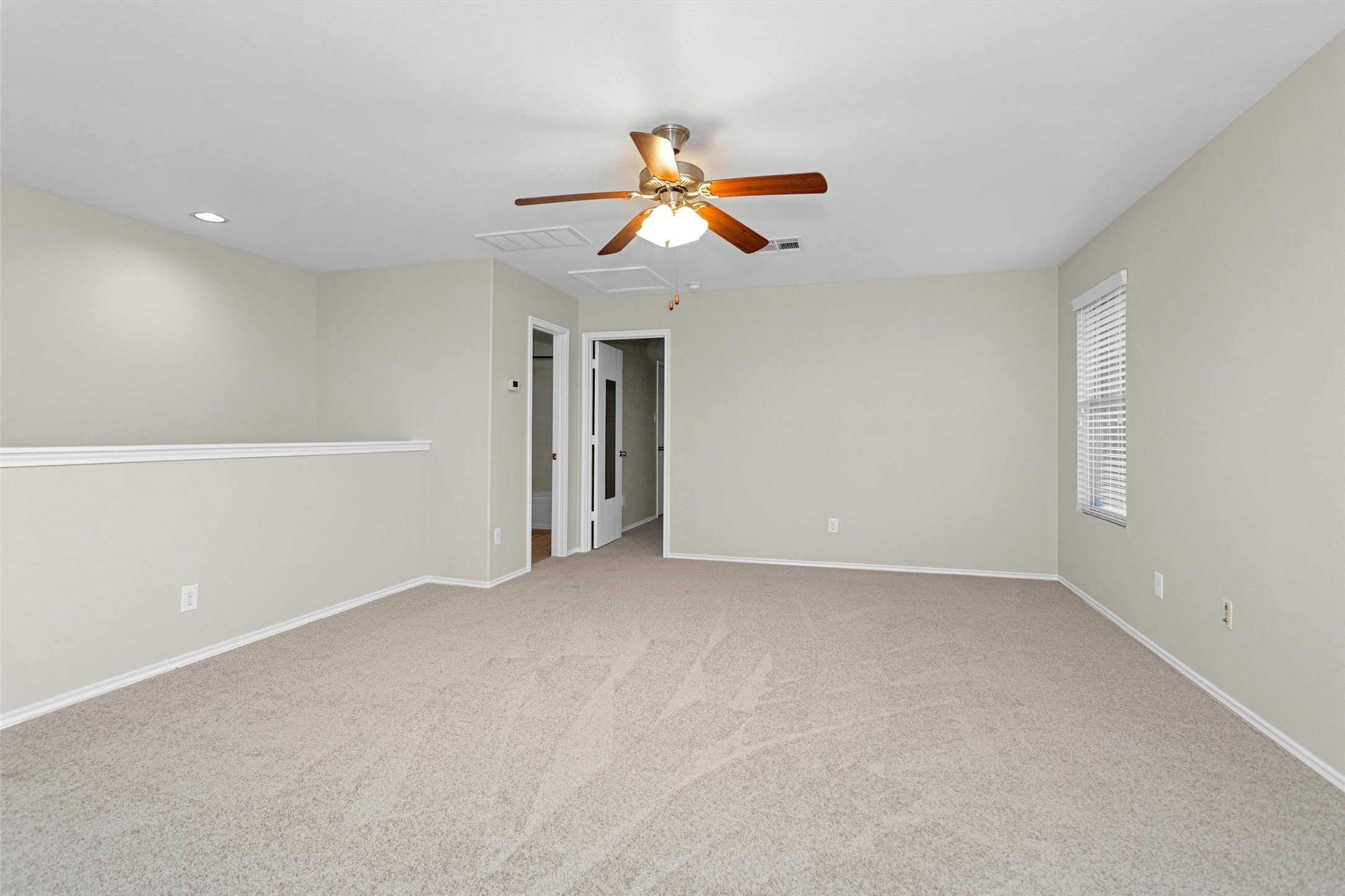 21419 Fossil Trails Drive Spring, TX 77388 - Photo 35 of 42 wooden floor in an empty room with a window