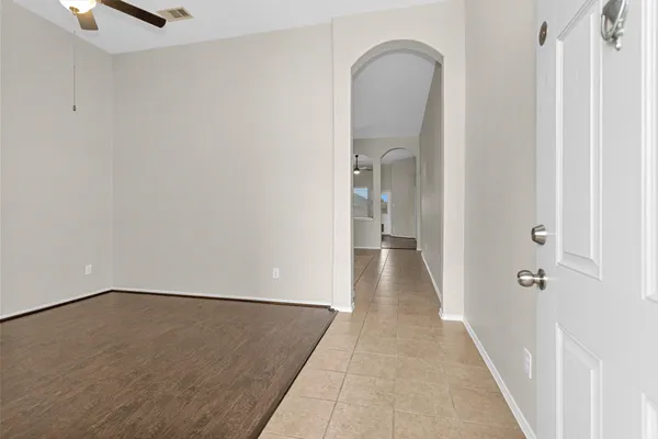 a view of an empty room with a window