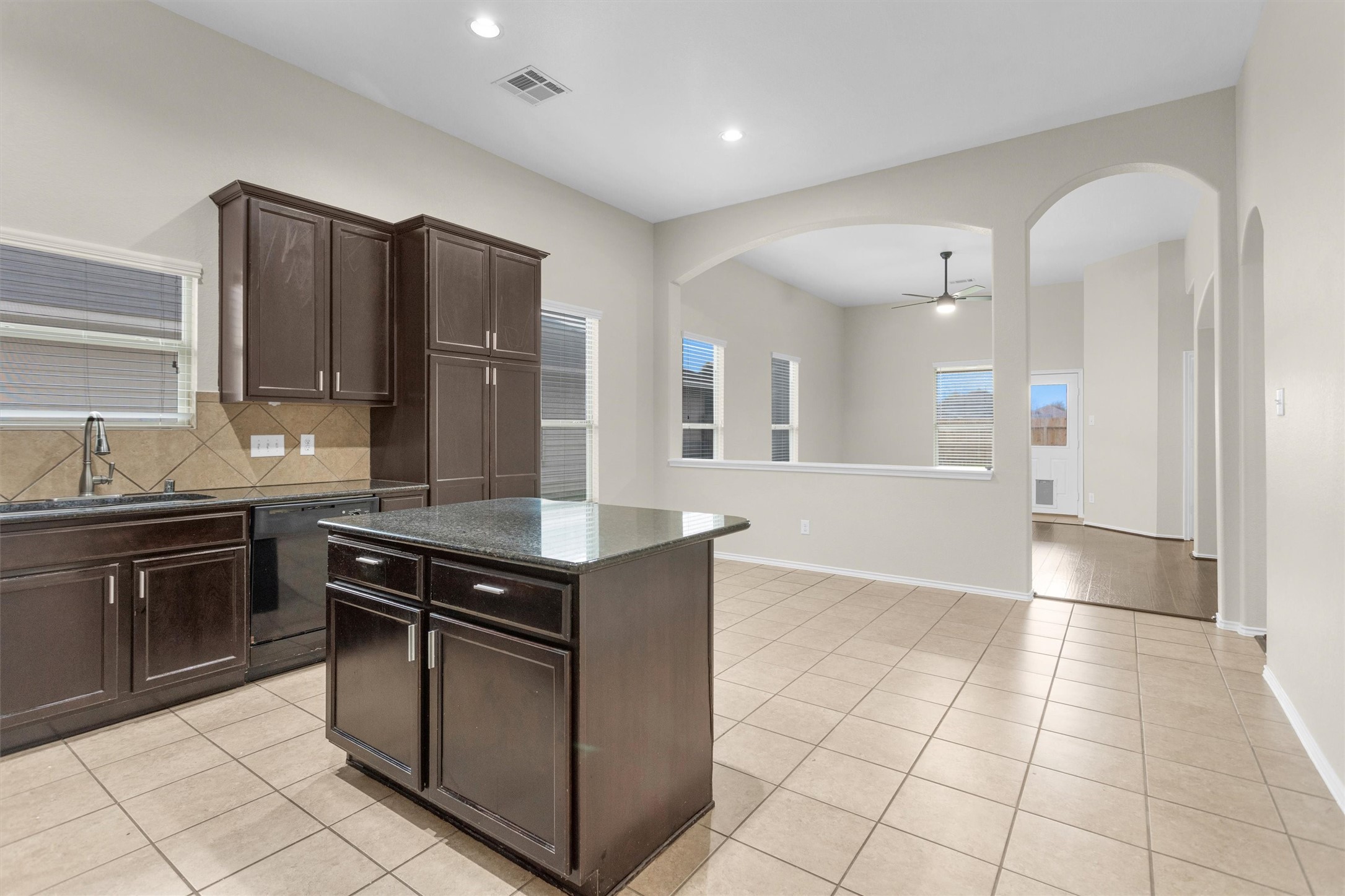 21419 Fossil Trails Drive Spring, TX 77388 - Photo 10 of 42 a kitchen with stainless steel appliances granite countertop a stove a sink and a refrigerator