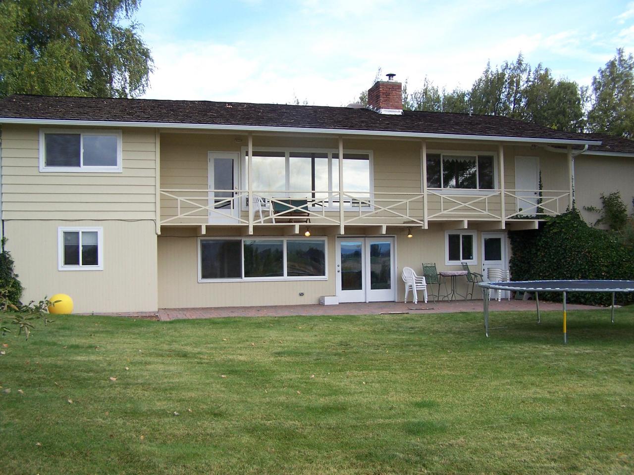 12202 Summitview Ext Road Yakima, WA 98908 - Photo 1 of 19 a front view of house with yard and outdoor seating