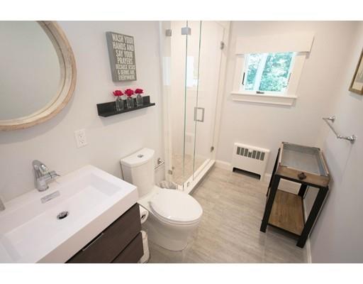 19 Fairview Road Weston, MA 02493 - Photo 13 of 20 a bathroom with a sink mirror vanity and toilet