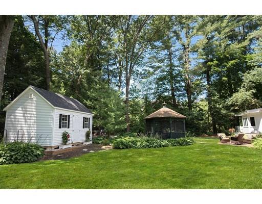 19 Fairview Road Weston, MA 02493 - Photo 19 of 20 a front view of a house with a garden and trees